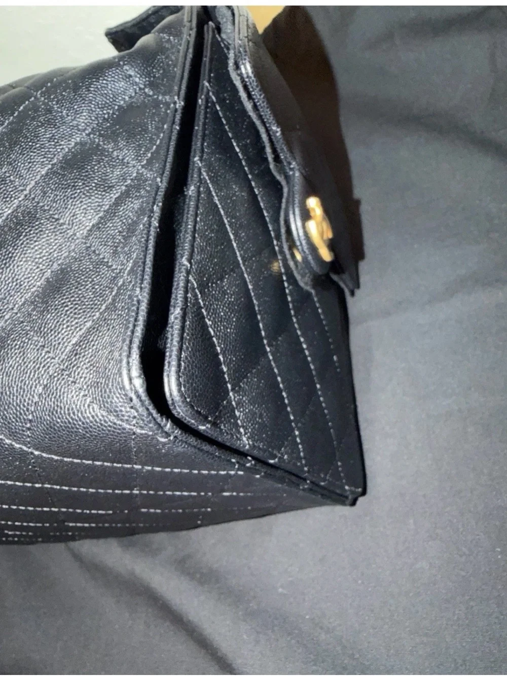 Chanel 25 bag in black grain leather and golden hardware. Medium size.